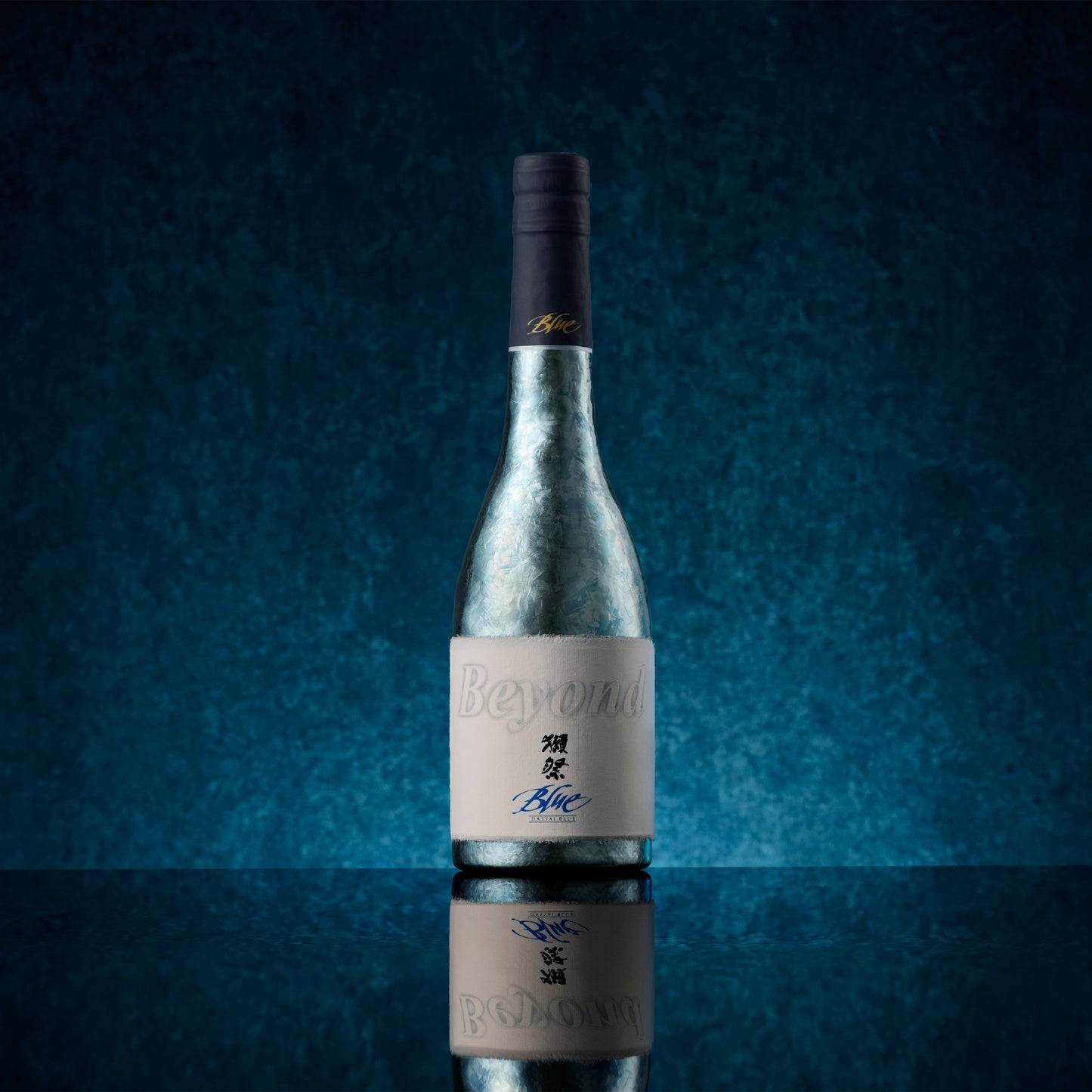 Metallic Sake bottle with a dark blue background