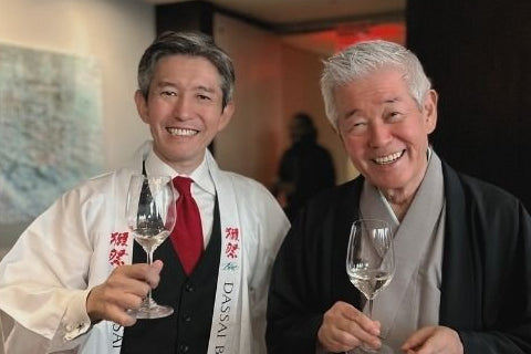 DASSAI Chairman Hiroshi Sakurai and CEO Kazuhiro Sakurai raising a glass